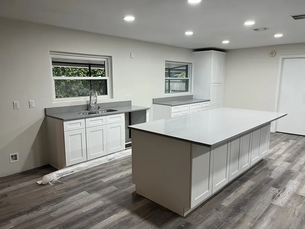Renovated living space with new flooring and trim work.