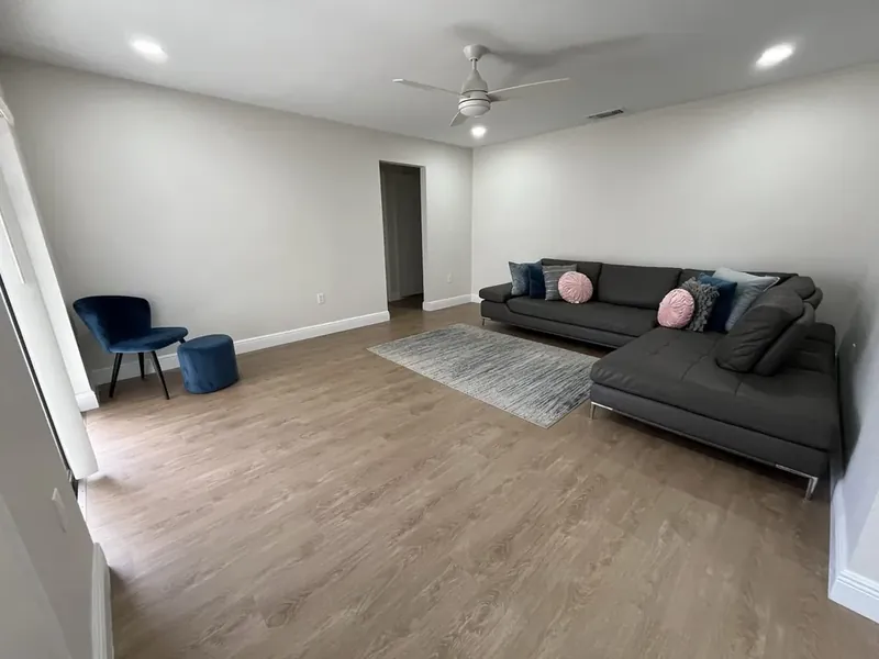 New hardwood flooring running through a renovated main floor.