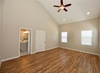 Renovated home interior with a vaulted ceiling and new flooring
