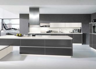 Modern kitchen installation with an island and range hood