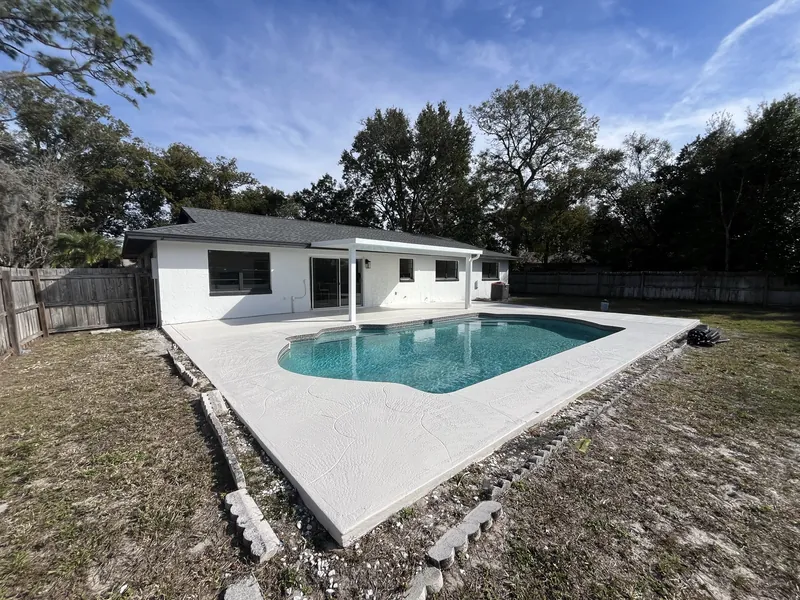 A newly completed room addition attached to an existing home.